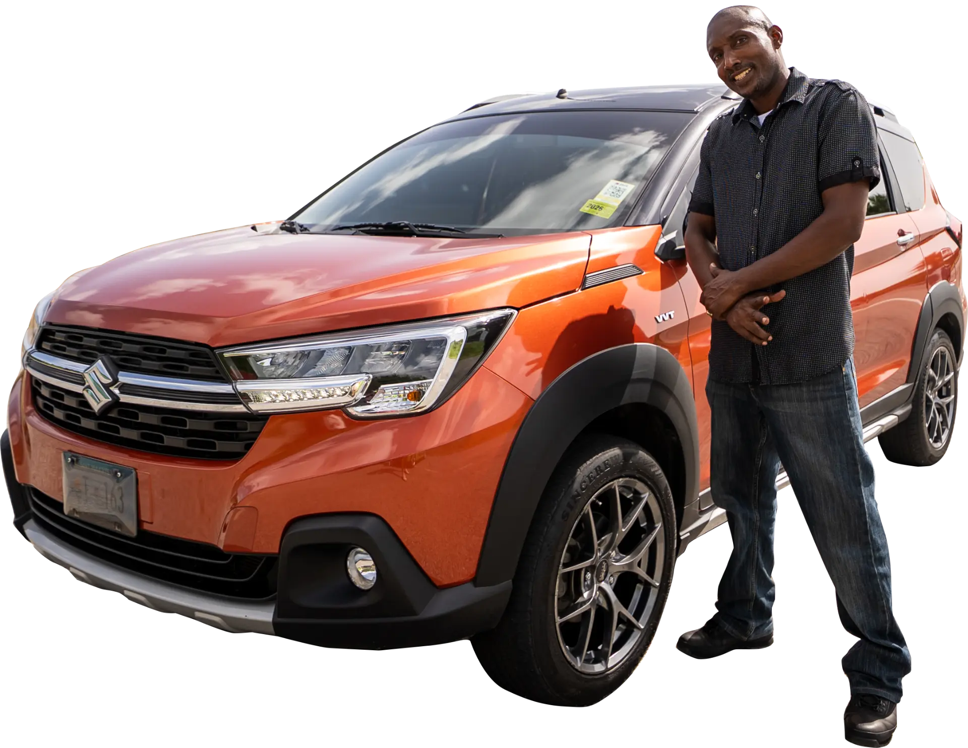 Nature Tours driver standing next to the orange Suzuki XL7